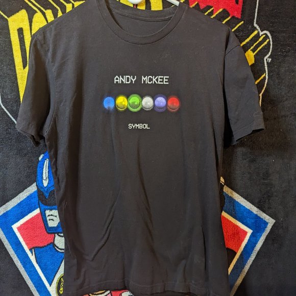 Andy Mckee Symbol Guitarist Black T-Shirt.  In good condition, size medium. - Picture 1 of 3